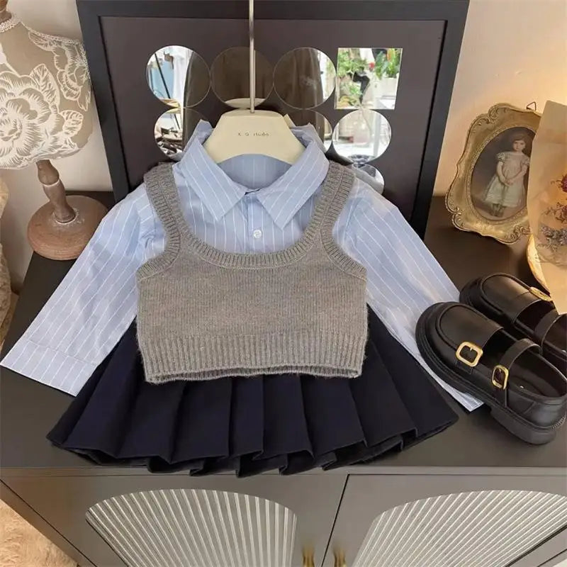 Fashion Baby Girl Set Shirt Vest and Pleated Skirt Toddler Outfit 2PCS with black shoes on table