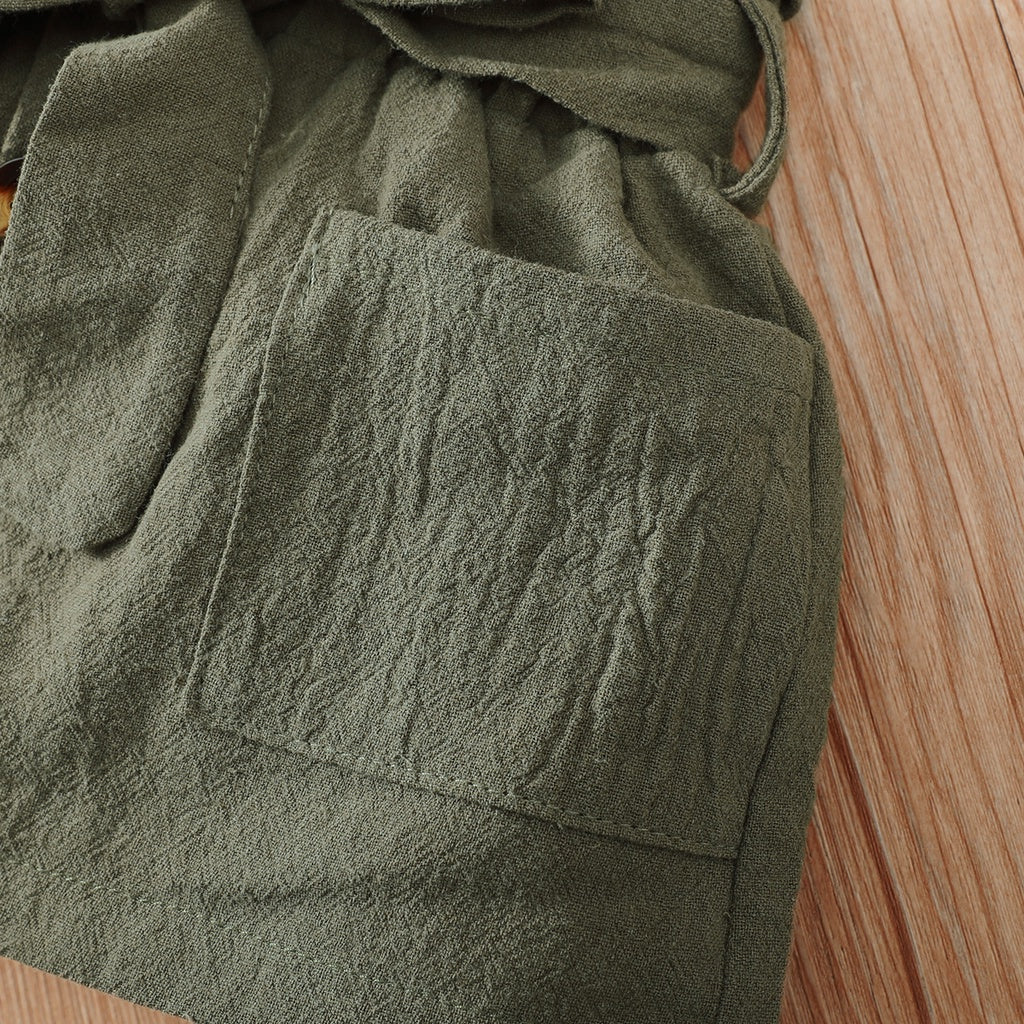 Close-up view of olive green fabric pocket detail from Yamza Tots' Closet 2PCS Baby Girl Clothing Set