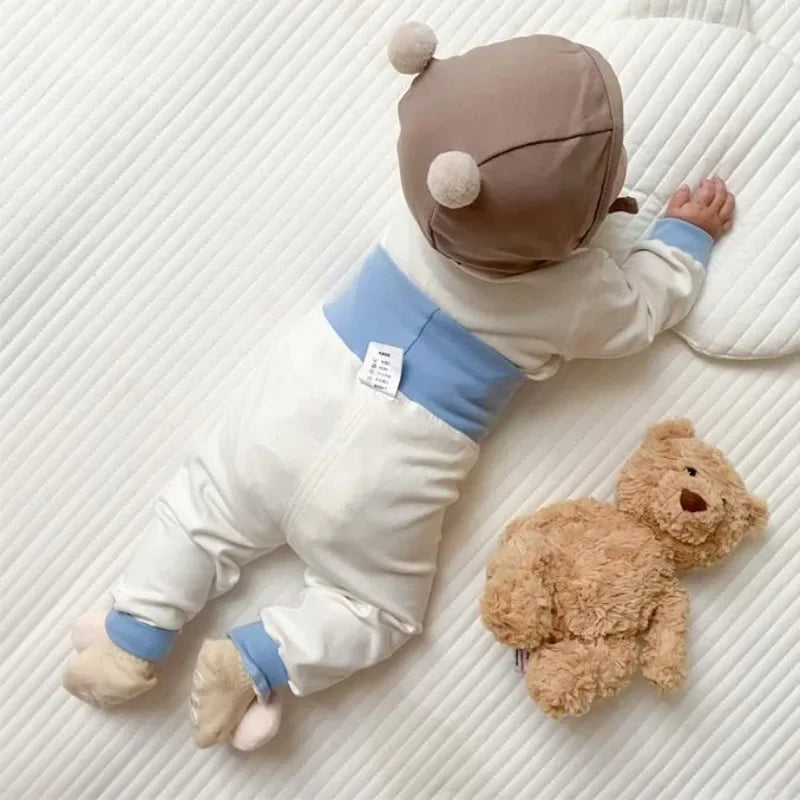 Baby wearing Baby 2PCS Pajama Set Cotton Long Sleeve Outfit for Autumn Winter Wear lying next to a teddy bear