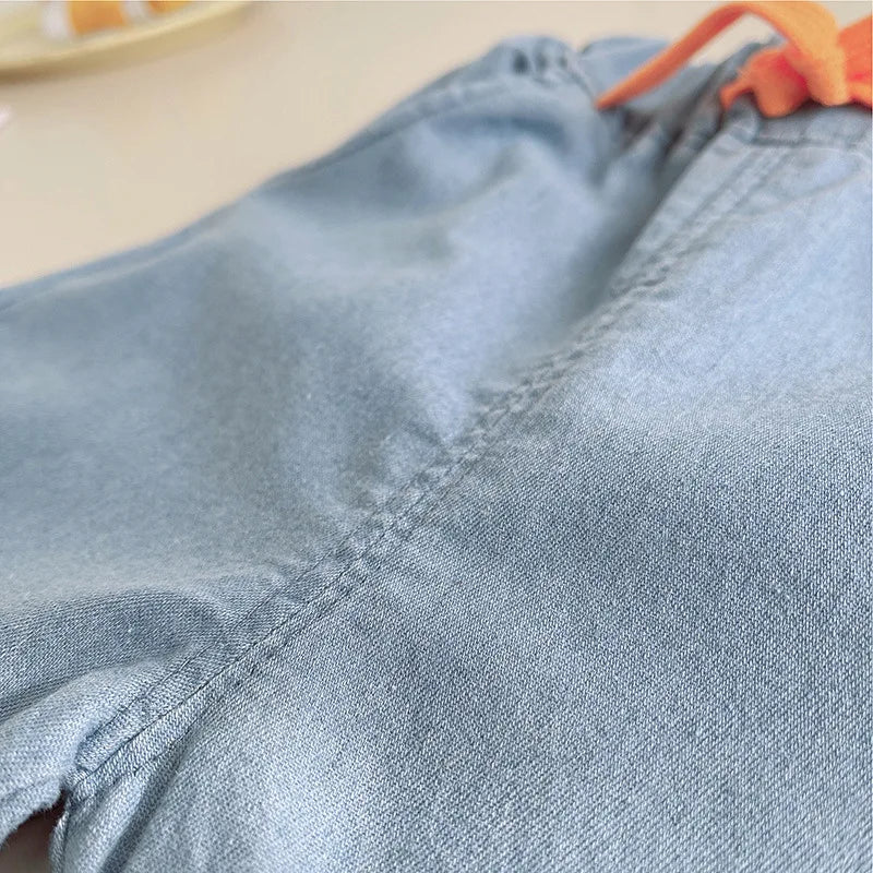 Close-up of light blue shorts from Baby Boy's Clothing Outfits Sets T-shirt & Shorts suits by Yamza Tots' Closet