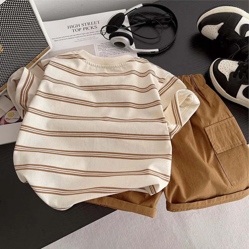 Baby Boys Striped Clothing Suits with beige and brown striped shirt and brown shorts laid out with black and white sneakers