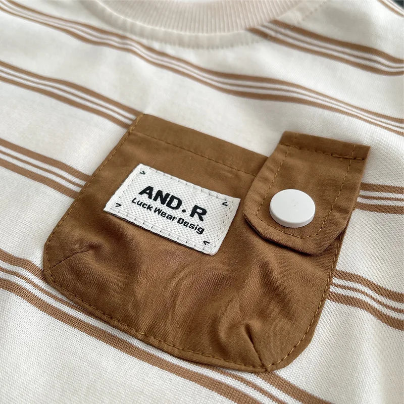 Close-up of brown pocket with white button on striped baby boys striped clothing suits by Yamza Tots' Closet