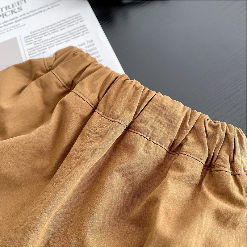 Close-up of comfortable brown elastic waistband pants from Yamza Tots' Closet baby boys striped clothing suits