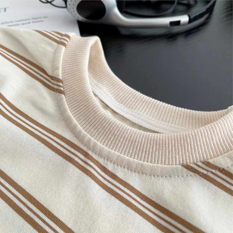 Close-up of baby boys striped clothing suits collar in beige and brown stripes by Yamza Tots Closet