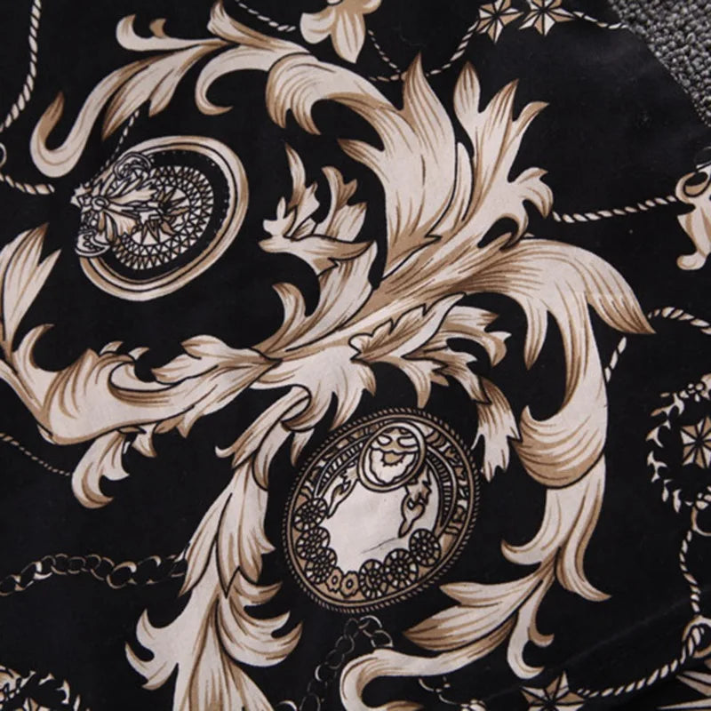Close-up of Baby Boy's Suit Fashion Print Clothes with intricate beige and black floral and geometric patterns