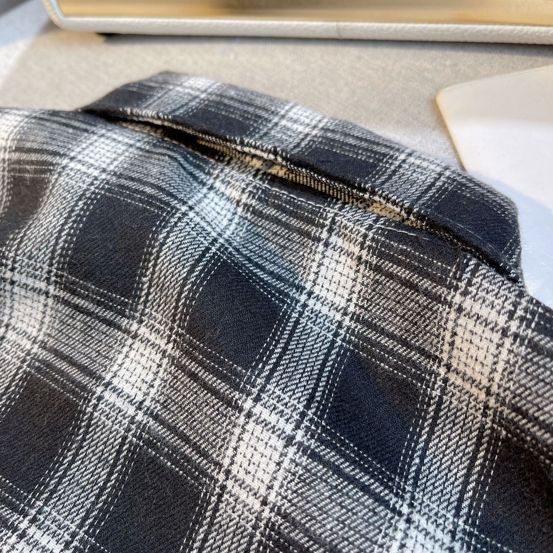 Close-up of black and white plaid fabric on Baby Boys Summer Plaid Outfit Cozy Striped Shirts Tees and Shorts Set