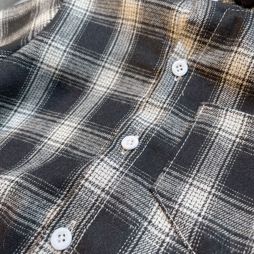 Close-up of black and white plaid shirt buttons from Baby Boys Summer Plaid Outfit Cozy Striped Shirts Tees and Shorts Set