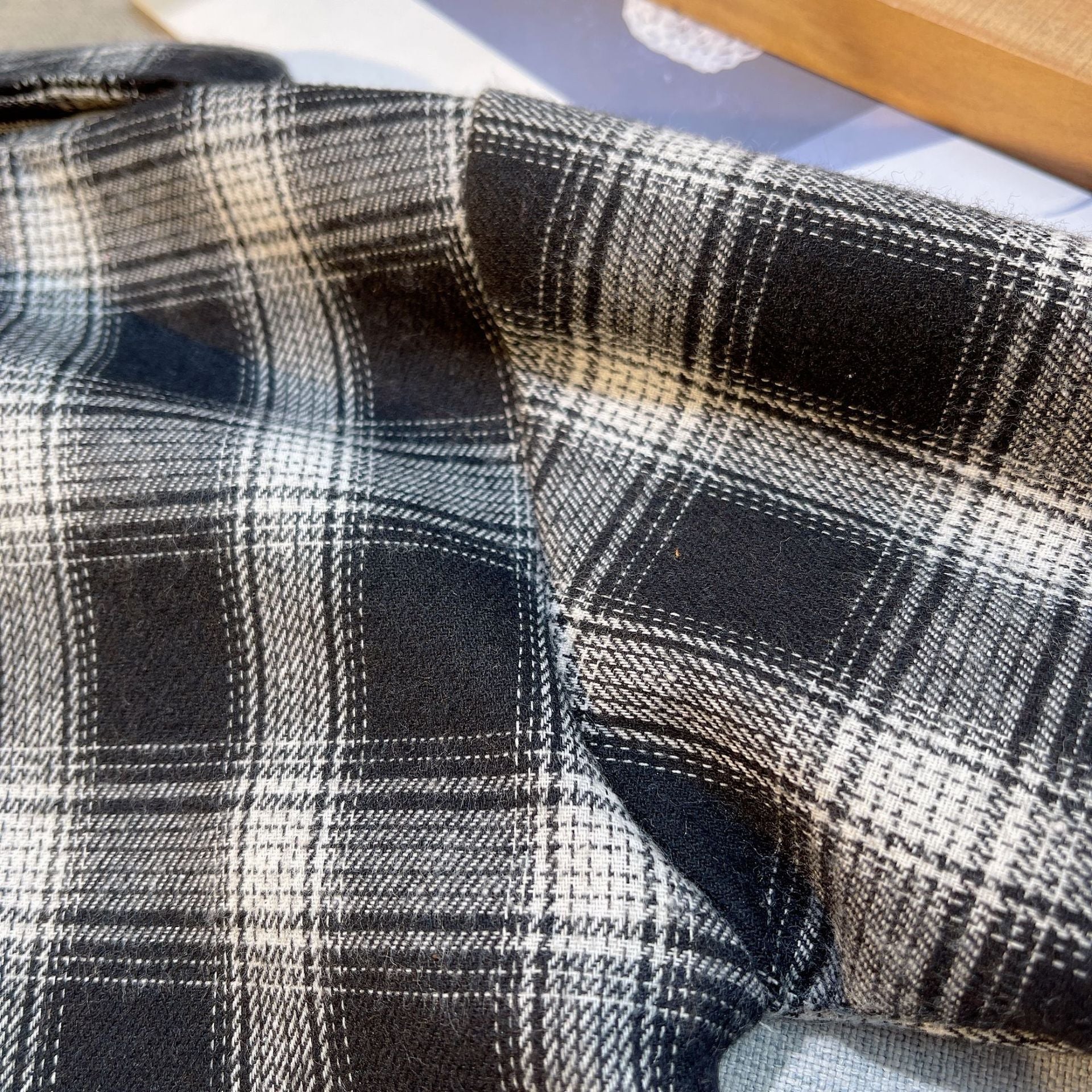 Close-up of black and white plaid fabric from Baby Boys Summer Plaid Outfit Cozy Striped Shirts Tees and Shorts Set