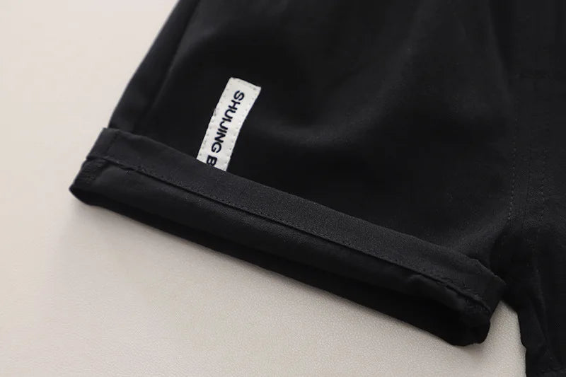 Close-up of black shorts hem detail from Baby Boys Summer Set Striped Shirts Tees and Shorts