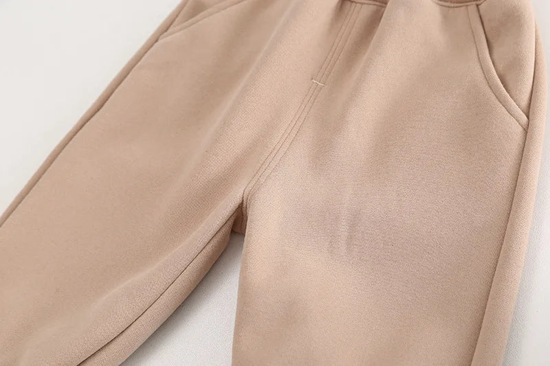Beige pants detail from Baby Clothes Children Set Boys T-Shirt Pants 2Pcs Sets by Yamza Tots Closet