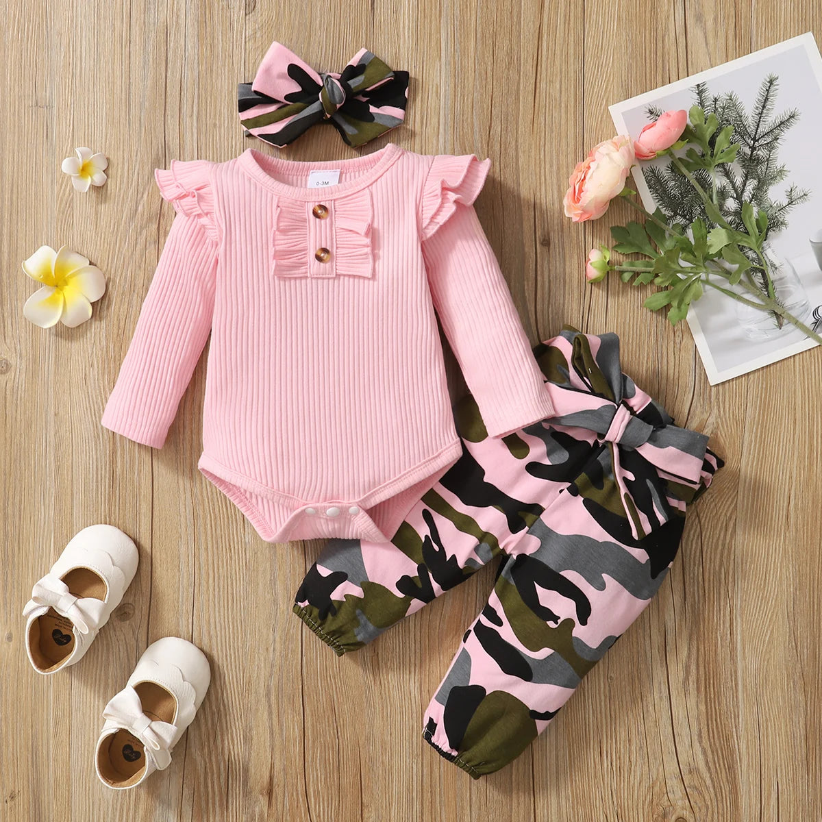 Baby Girl Camouflage Outfit Set with Long Sleeve Bodysuit and Headband featuring pink ruffles and camouflage pants