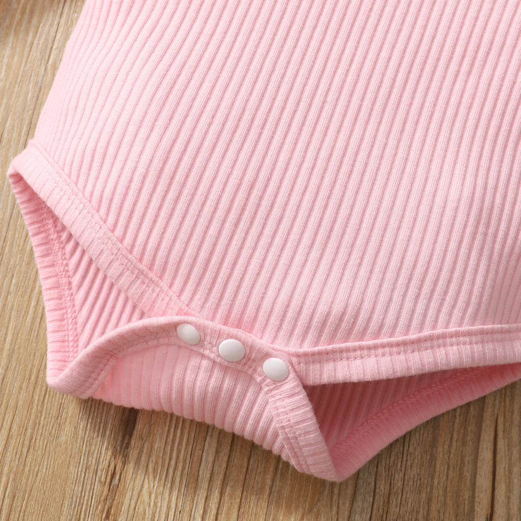 Close-up of pink ribbed fabric on Baby Girl Camouflage Outfit Set with Long Sleeve Bodysuit and Headband