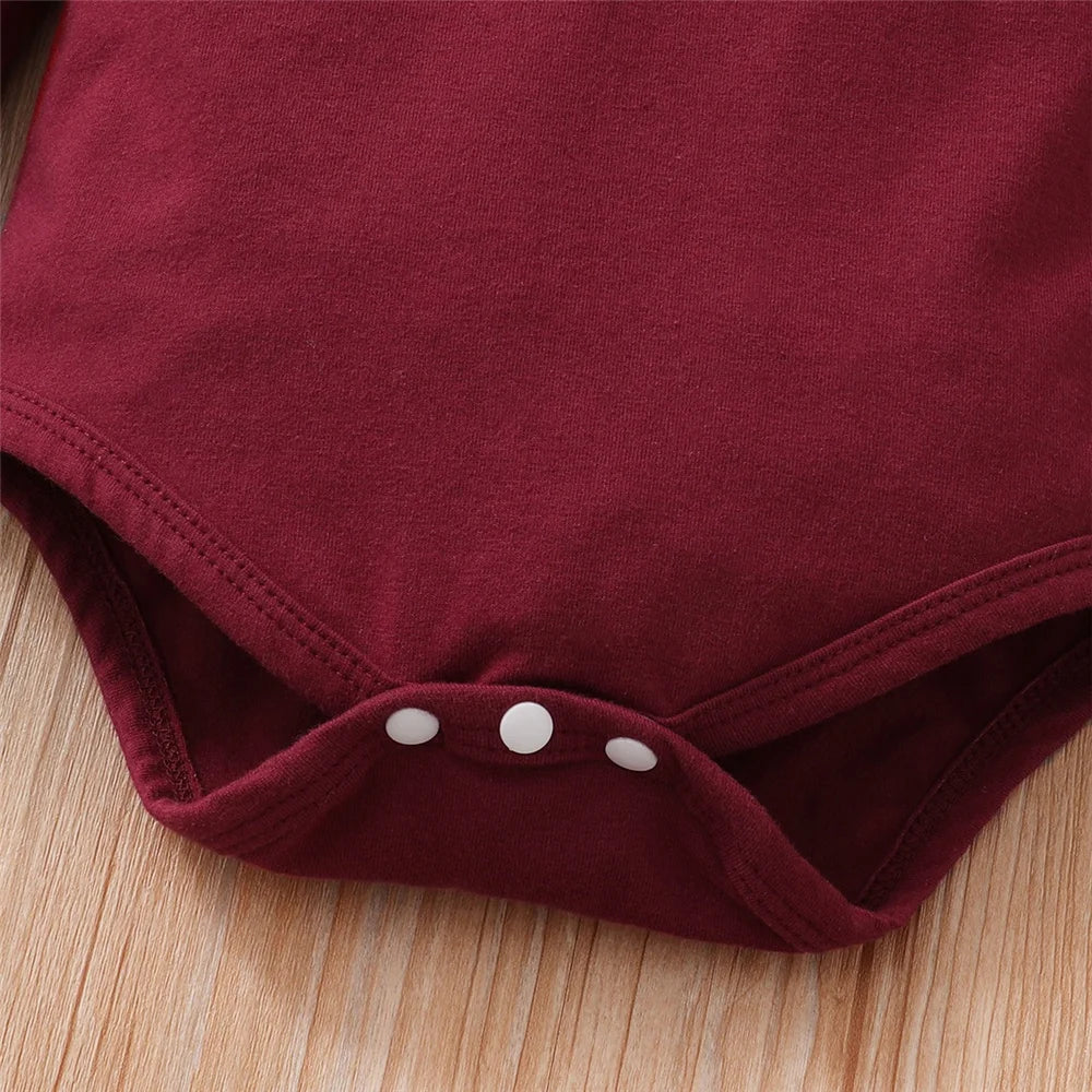 Close-up of red baby bodysuit snap buttons from Baby Girl Clothes Set Red Color 2PCS by Yamza Tots' Closet