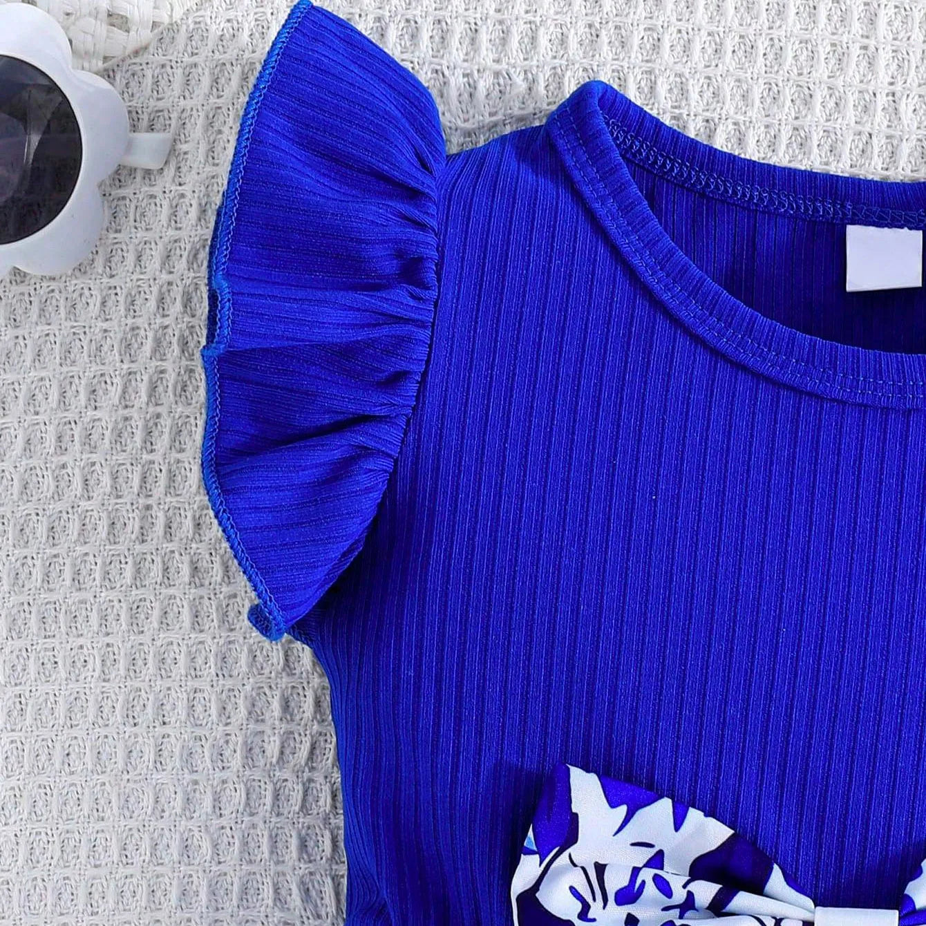 Close-up of Baby Girl Dress Small Flying Sleeve by Yamza Tots' Closet in vibrant blue ribbed fabric