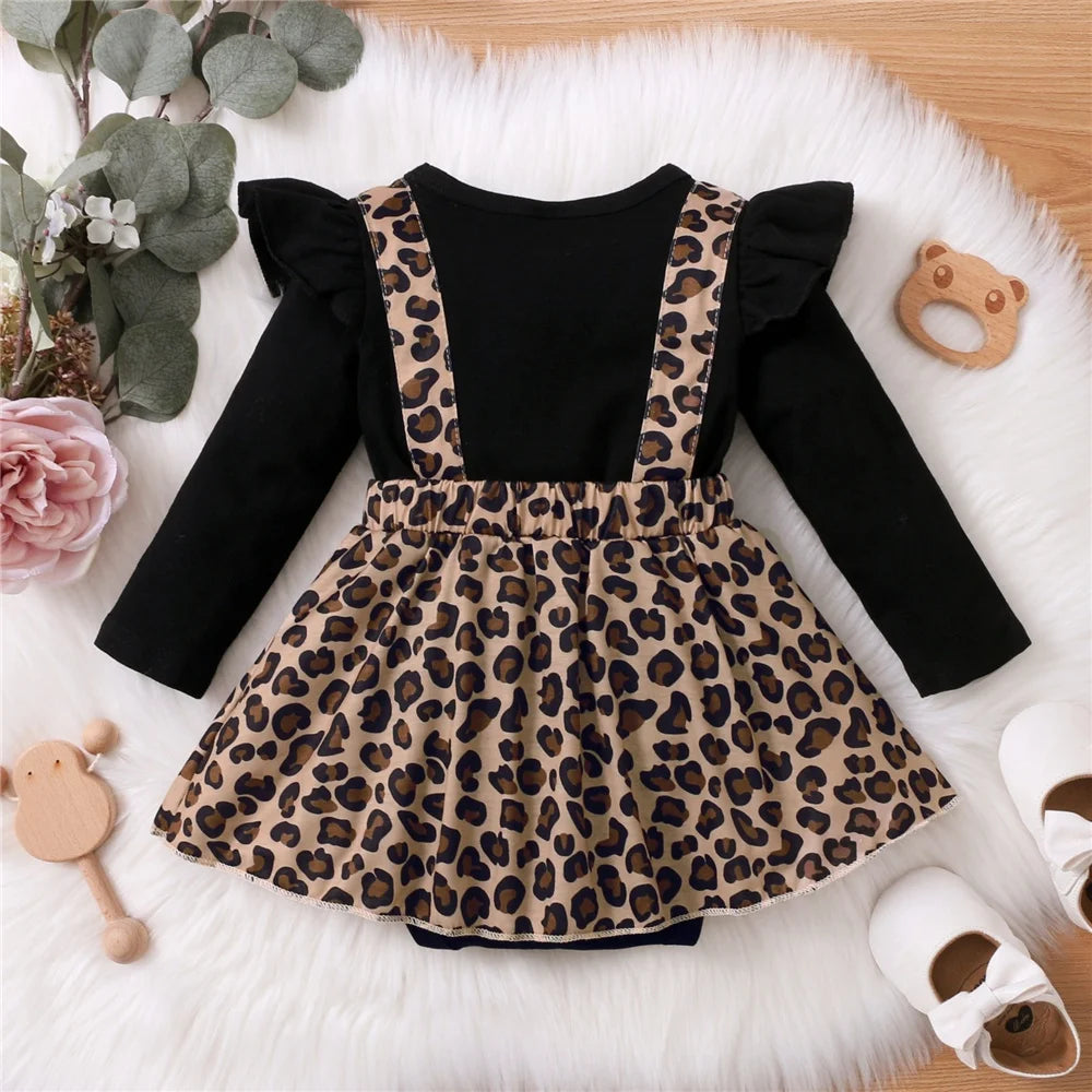 Baby Girl Dress with Bow featuring black long sleeves and leopard print skirt with suspenders