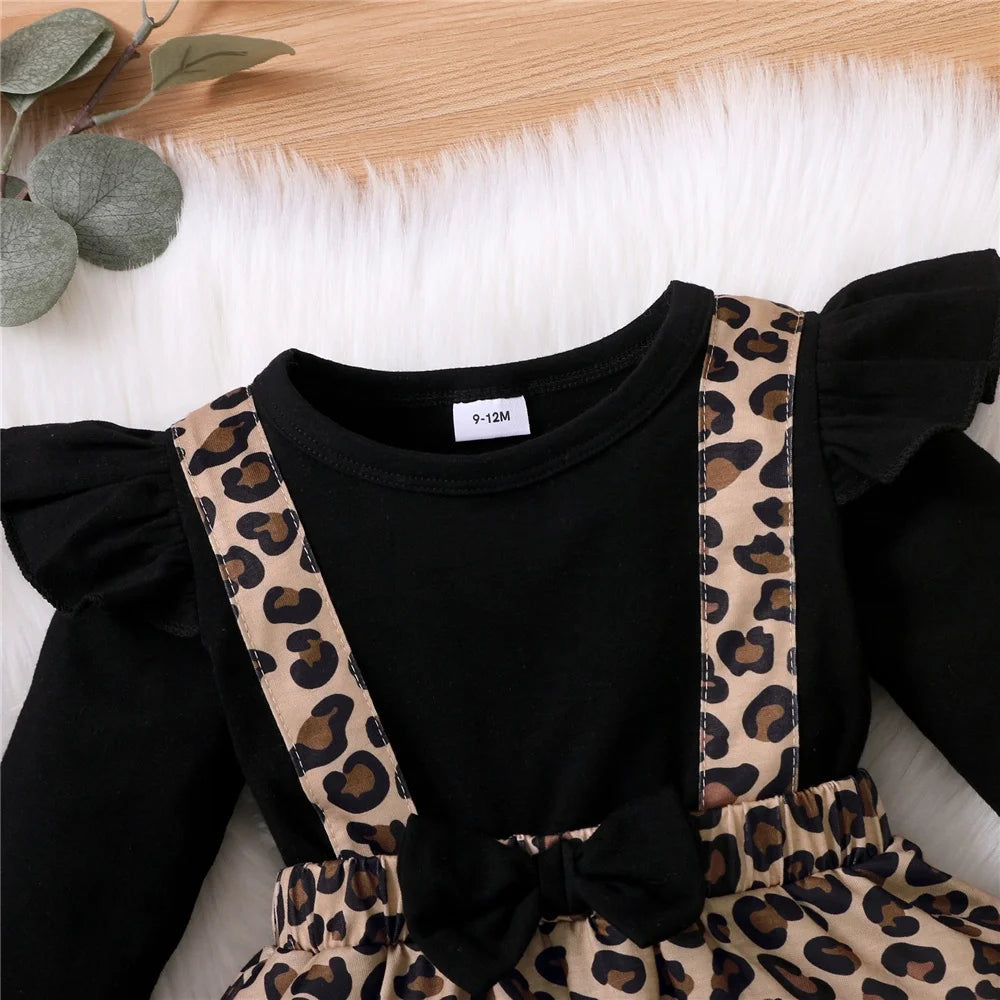 Baby Girl Dress with Bow featuring black top and leopard print suspender skirt by Yamza Tots Closet
