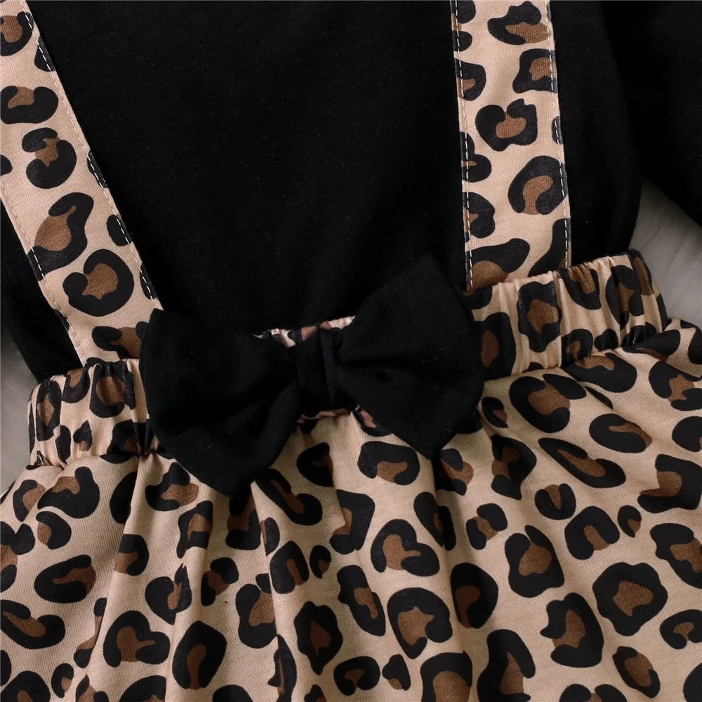 Baby Girl Dress with Bow featuring leopard print skirt and black bow detail from Yamza Tots Closet