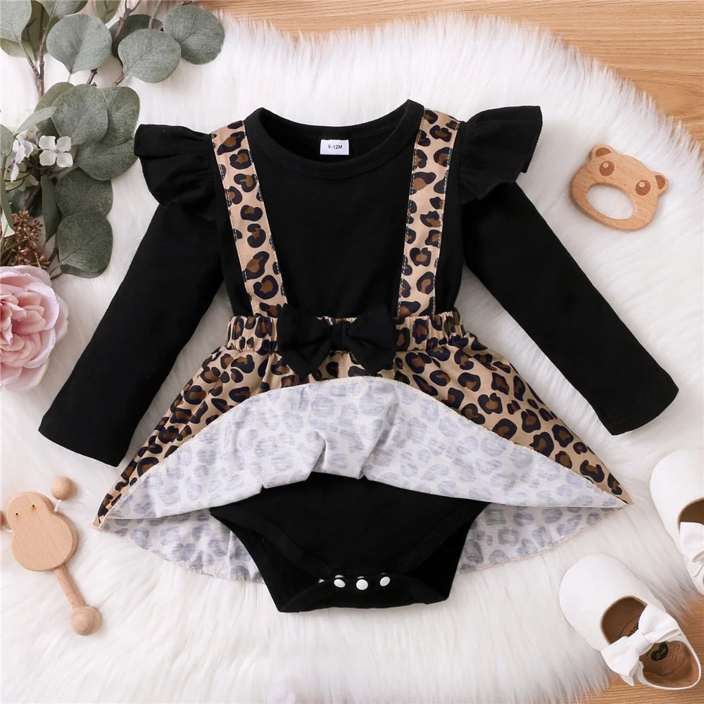 Baby Girl Dress with Bow featuring black long sleeves and leopard print skirt by Yamza Tots' Closet