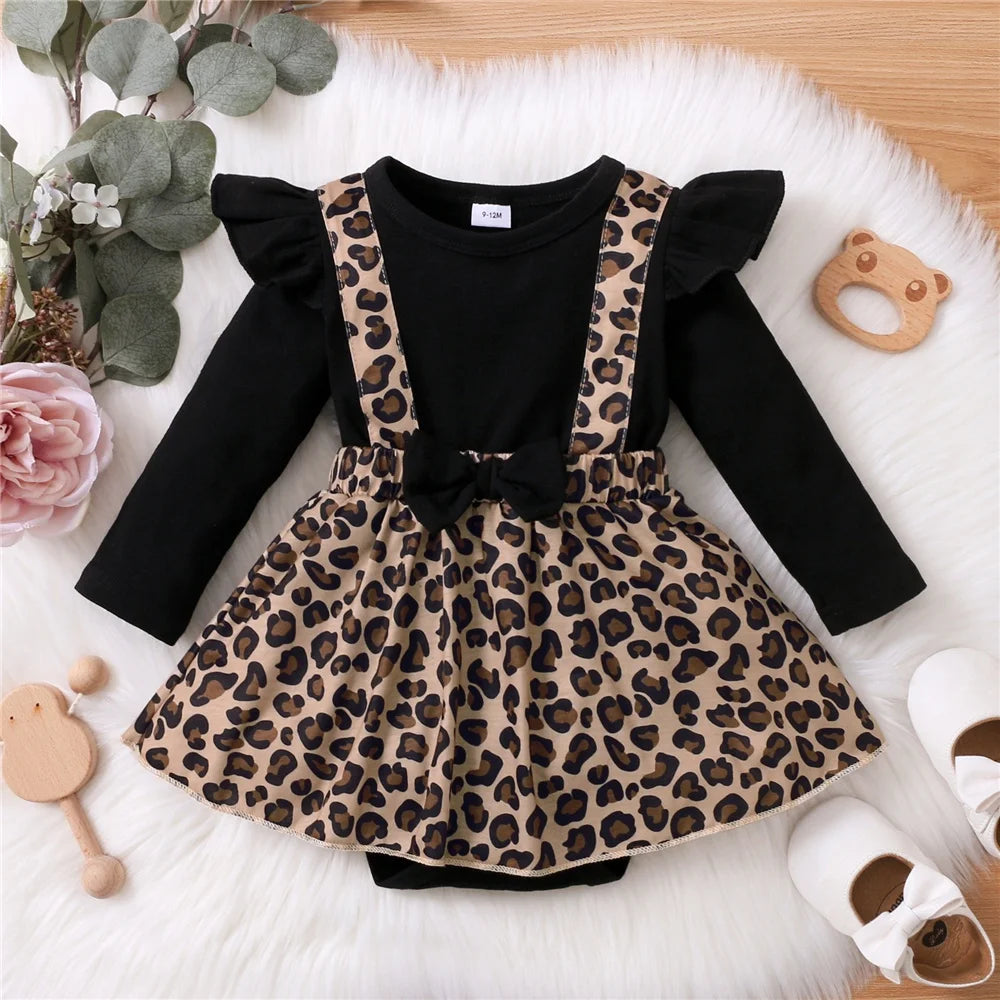 Baby girl dress with bow and leopard print suspender skirt over black long sleeve top