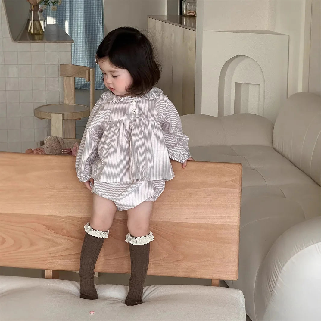 Baby girl wearing Yamza Tots' Closet Baby Girl Loose Striped Set with long sleeves and matching bloomers