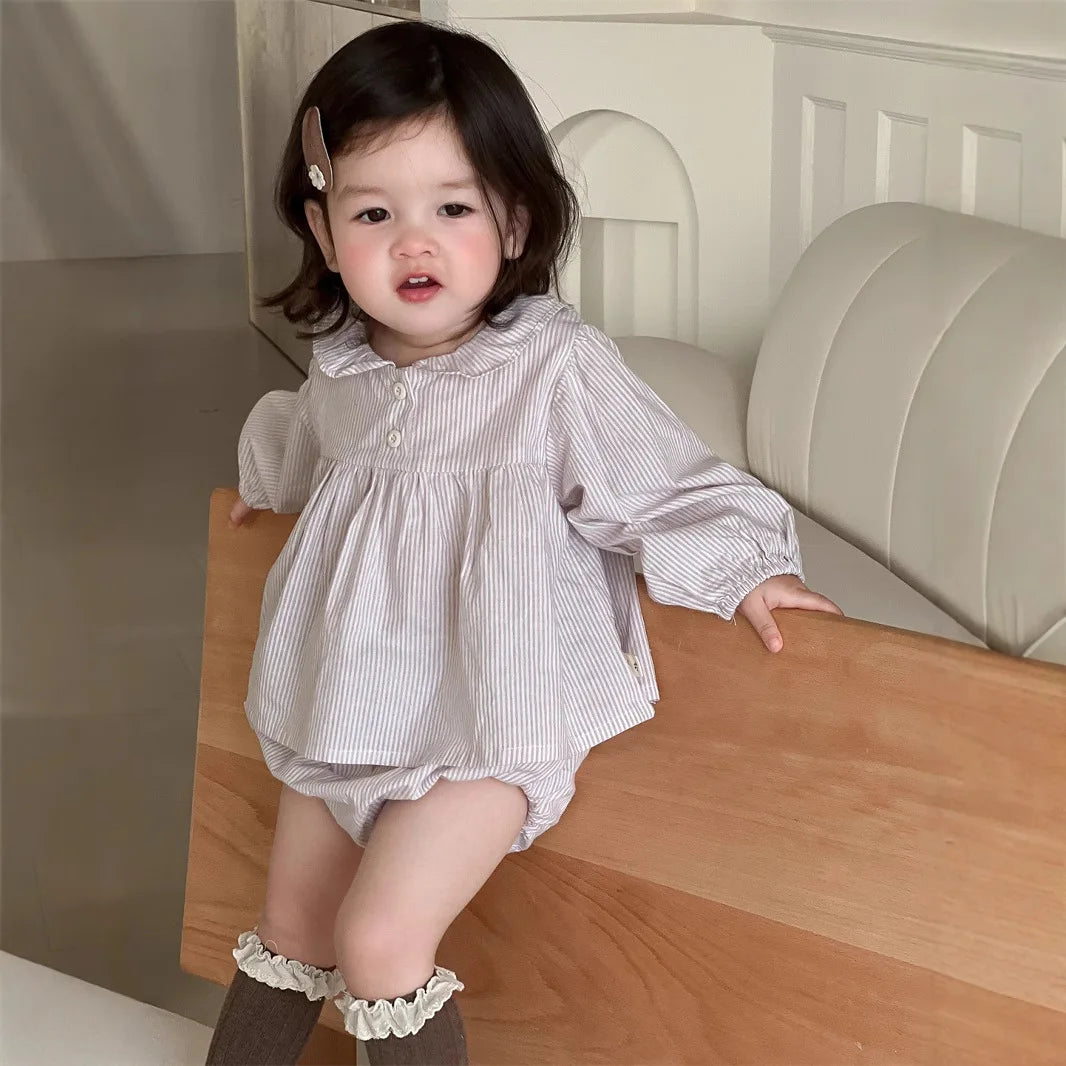 Baby girl wearing Yamza Tots' Closet Baby Girl Loose Striped Set with long sleeves and bloomer shorts