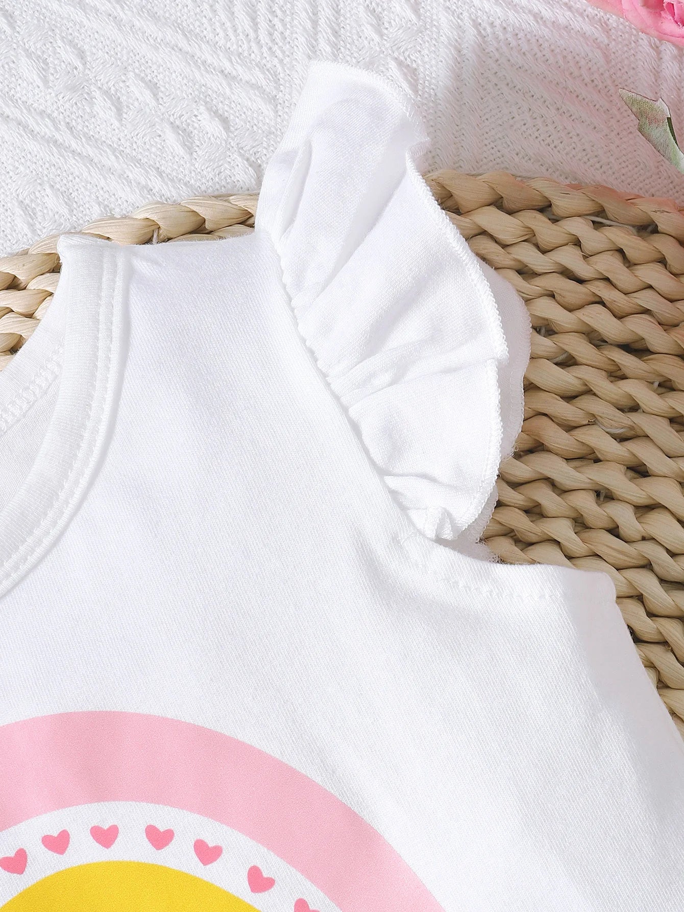 Close-up of white baby girl summer outfit rainbow tee with ruffled sleeve from Yamza Tots Closet