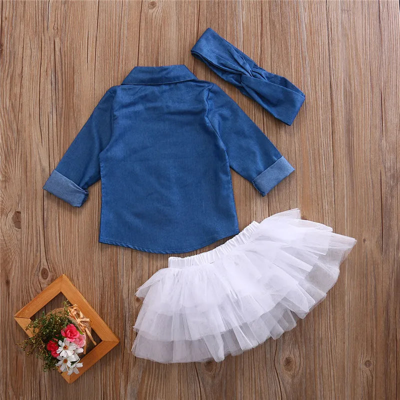 Baby Girls 3 Piece Outfit Set Denim Shirt Tutu Skirt and Headband Clothing laid flat on wooden surface