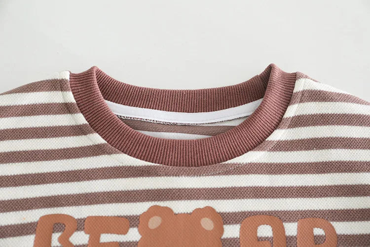 Close-up of striped baby girls and boys clothing brown and white crew neck sweater by Yamza Tots Closet