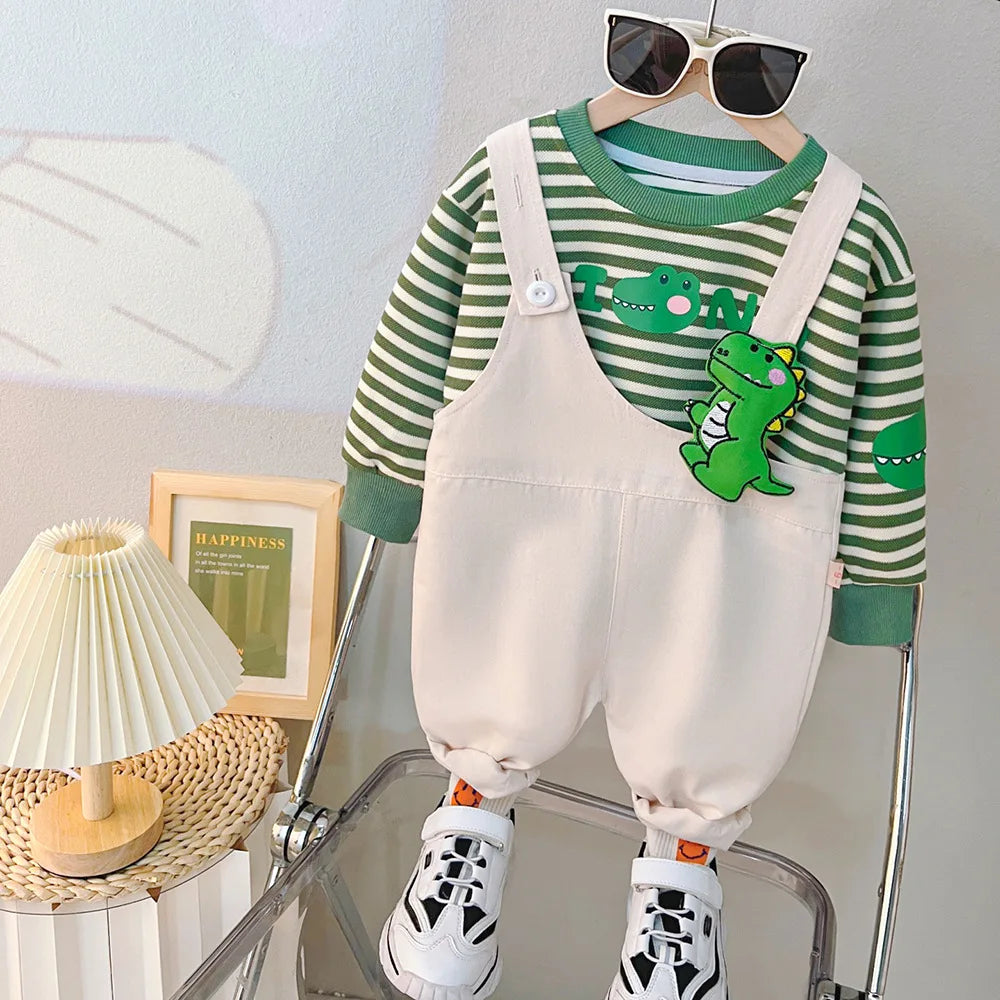 Yamza Tots Closet baby girls and boys clothing striped green dinosaur top with beige overalls and white sneakers