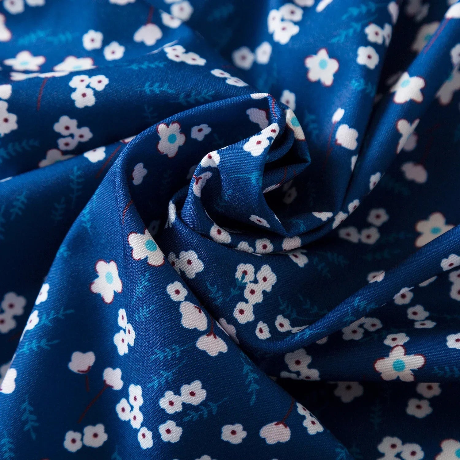 Close-up of blue fabric with white floral pattern for Baby Girls Floral Short Sleeve Dress Casual Summer Outfit for Kids
