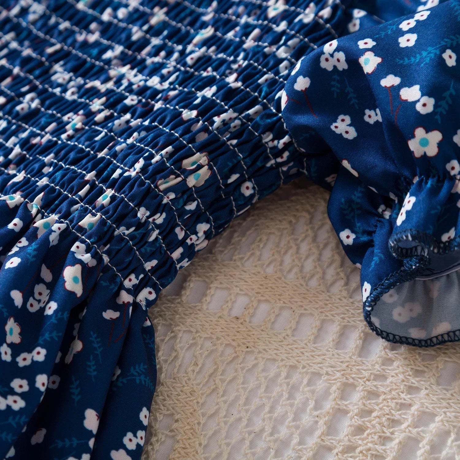 Close-up of blue Baby Girls Floral Short Sleeve Dress Casual Summer Outfit for Kids with white flowers