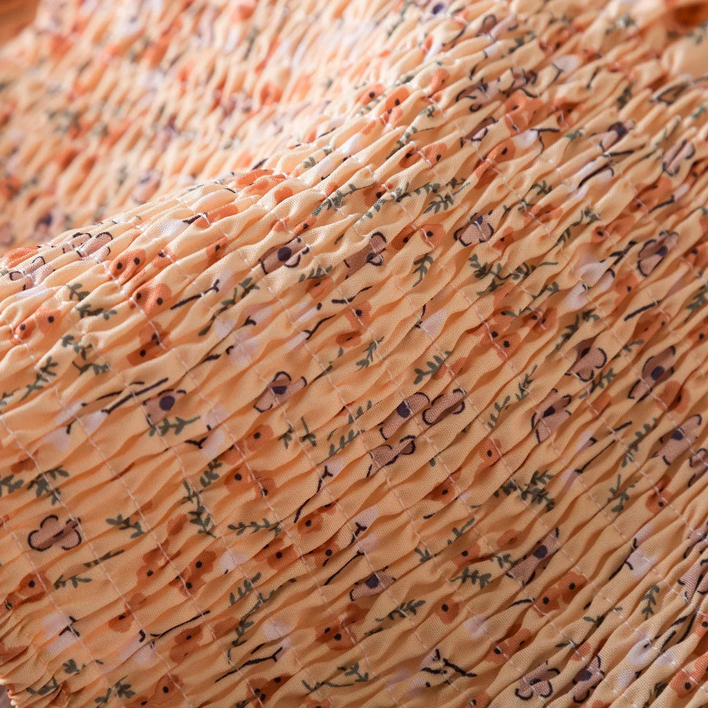 Close-up of textured fabric with floral print on Baby Girls Floral Short Sleeve Dress Casual Summer Outfit for Kids