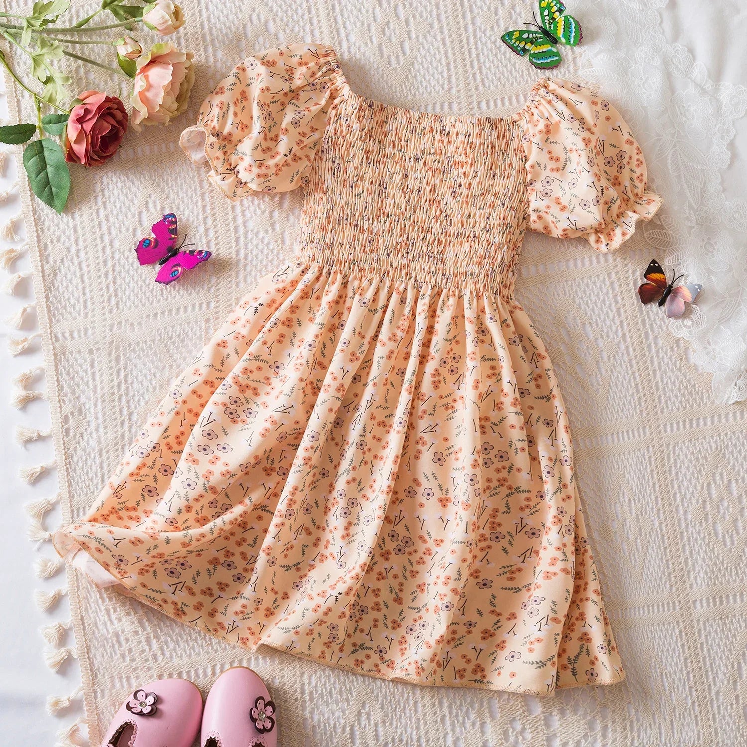 Baby Girls Floral Short Sleeve Dress Casual Summer Outfit for Kids with puff sleeves and smocked bodice in peach color