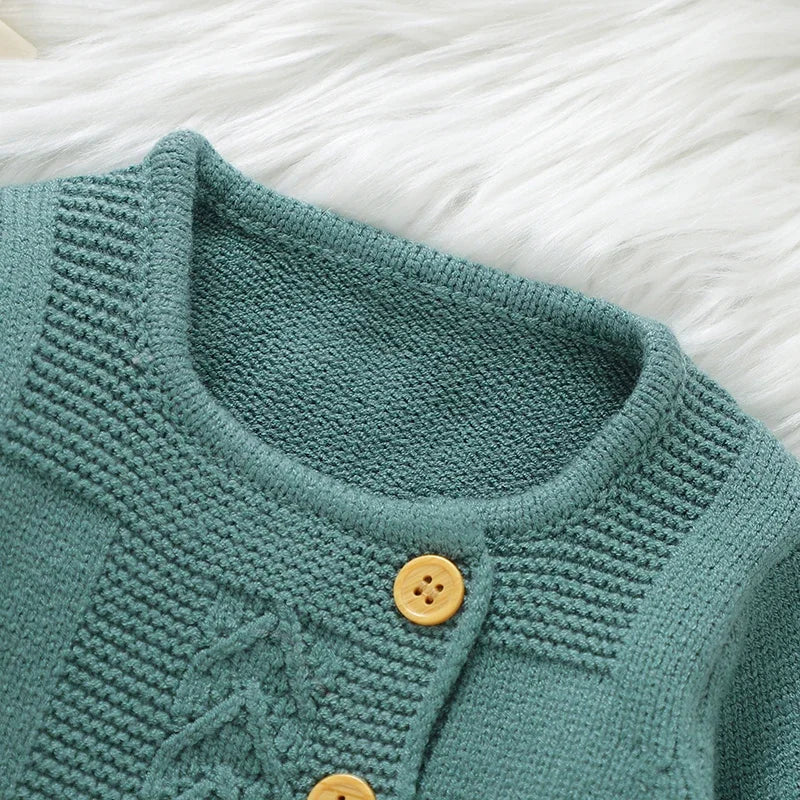 Close-up of green Baby Knit Sweater Set 2PC Warm Pullover and Pants for Autumn Fashion showing knit texture and wooden buttons