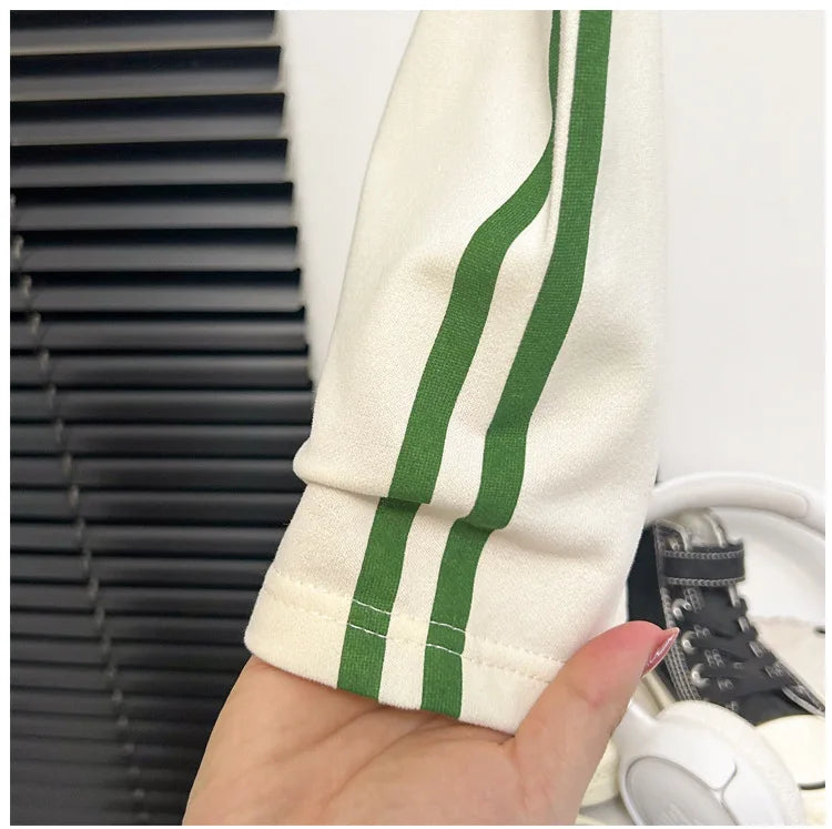 Close-up of sleeve with green stripes from Baby Striped Short Sleeve T-shirt Set Summer Loungewear for Boys Girls