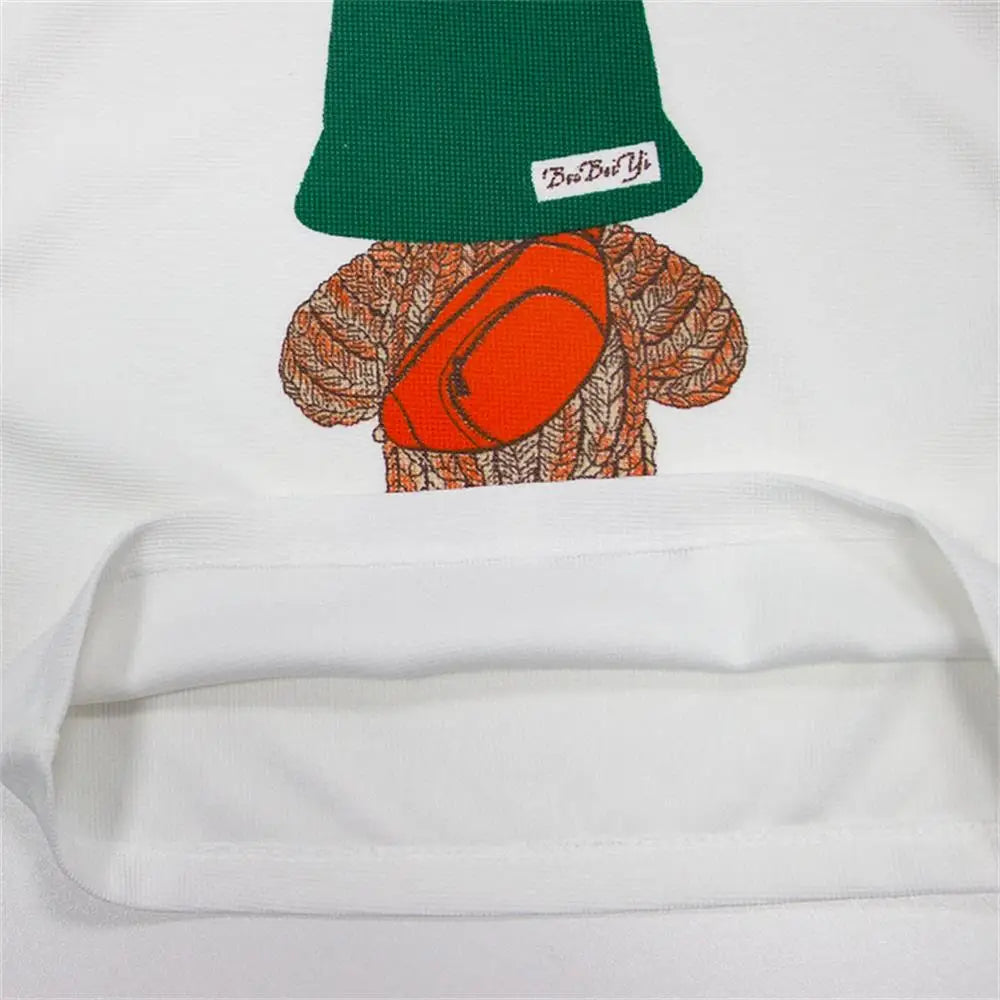 Close-up of Baby Summer Casual Set Loose Cute Top and Shorts Two-Piece Outfit with bear design and green hat