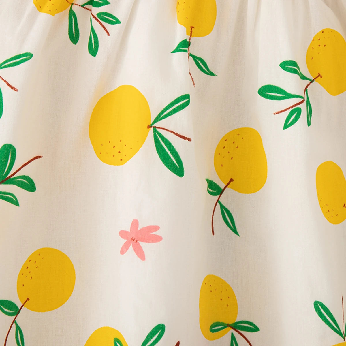 Close-up of Beach Dress Casual Fruit Printed with Hat Suit featuring yellow fruit and green leaves on white fabric