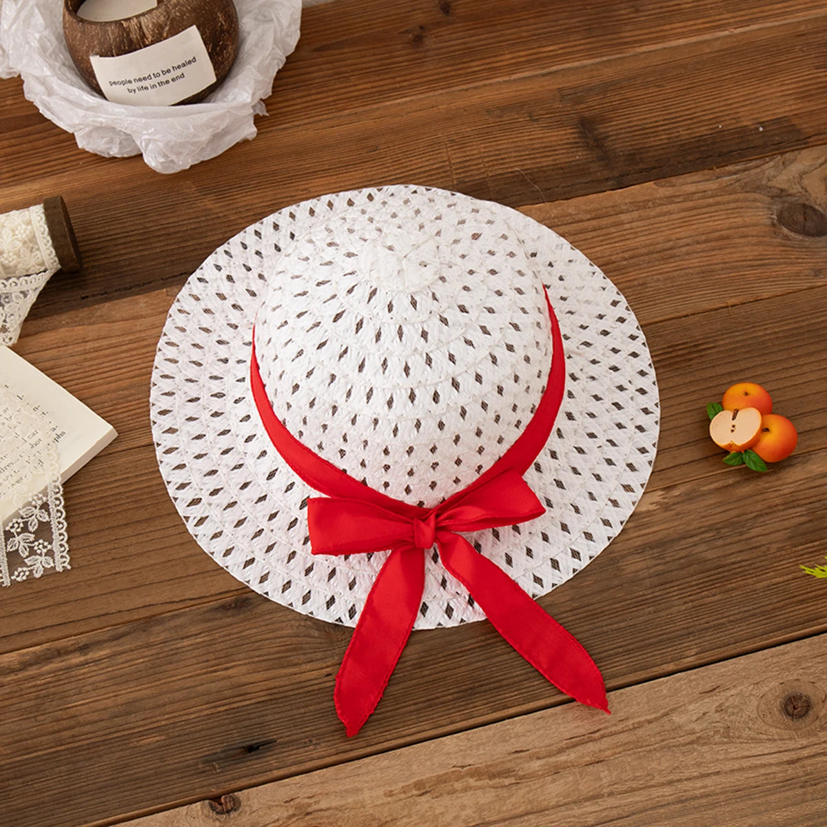 White woven sun hat with red ribbon bow, part of Beach Dress Casual Fruit Printed with Hat Suit by Yamza Tots' Closet