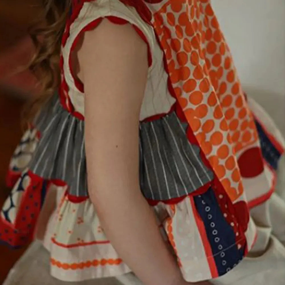Bear Leader Girls Summer Dress Round Neck Sleeveless Multicolor Geometric Dress on a child showing side and back view