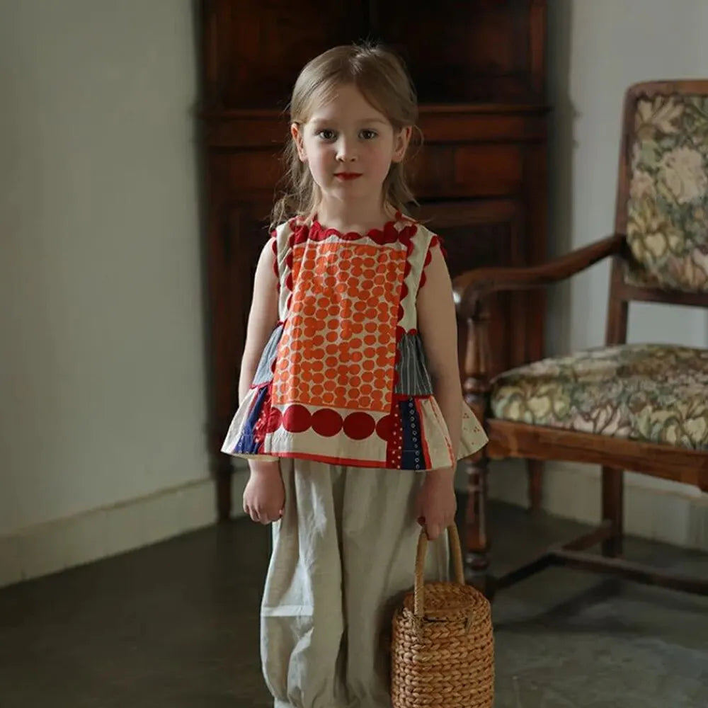 Bear Leader Girls Summer Dress Round Neck Sleeveless Multicolor Geometric Dress worn by girl holding woven bag indoors