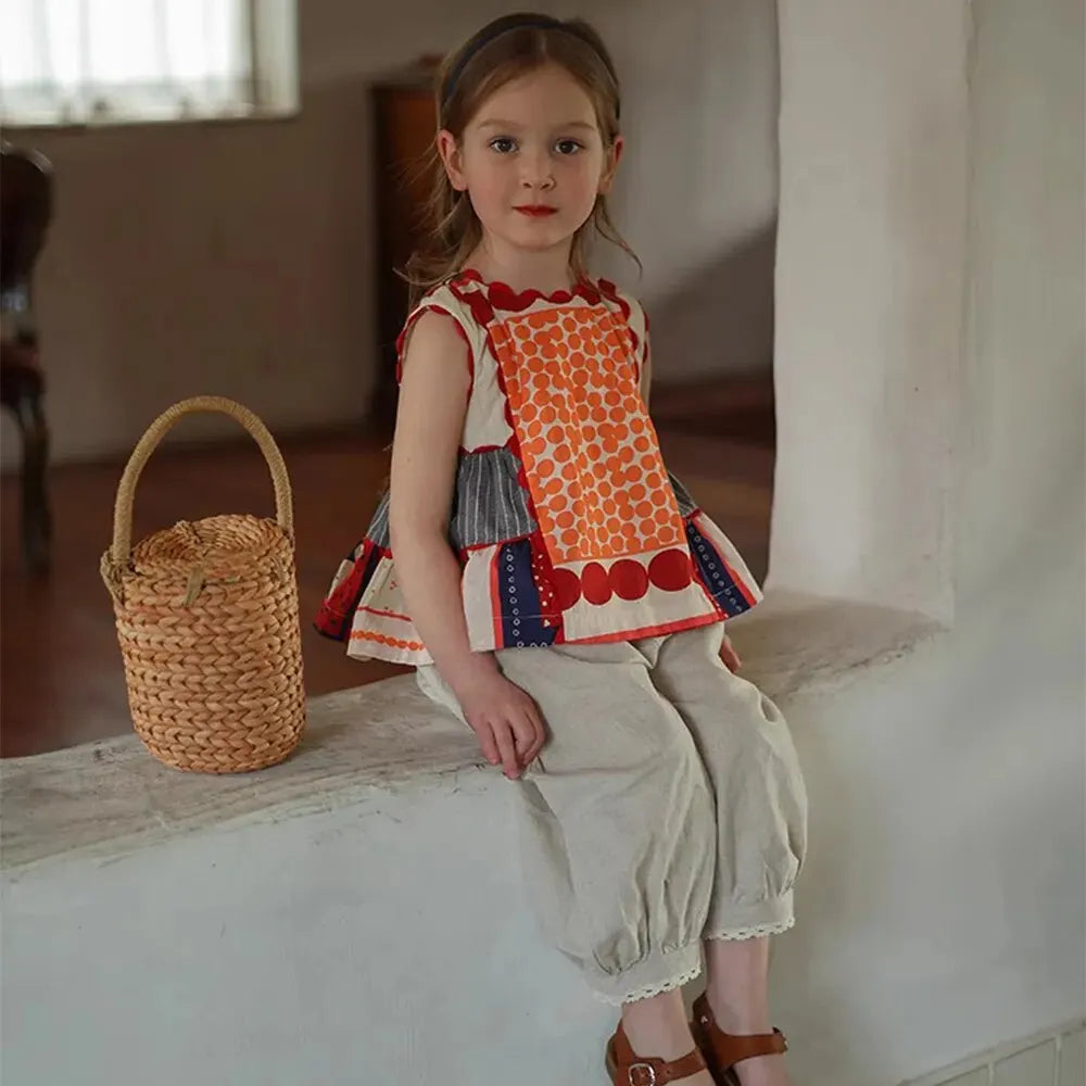 Bear Leader Girls Summer Dress Round Neck Sleeveless Multicolor Geometric Dress worn by girl sitting indoors