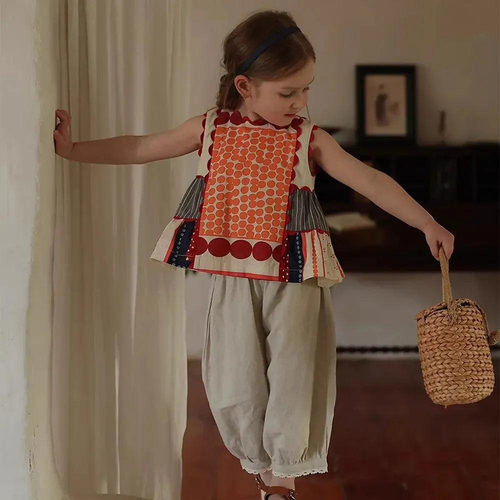 Bear Leader Girls Summer Dress Round Neck Sleeveless Multicolor Geometric Dress worn by girl holding woven basket 