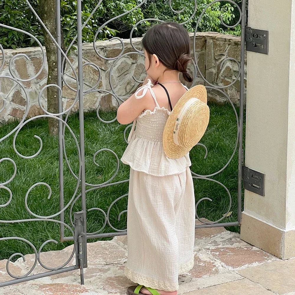Korean Kids Summer Organic Cotton Girls Camisole Top with Lace Wide Leg Pants worn by child outdoors near gate