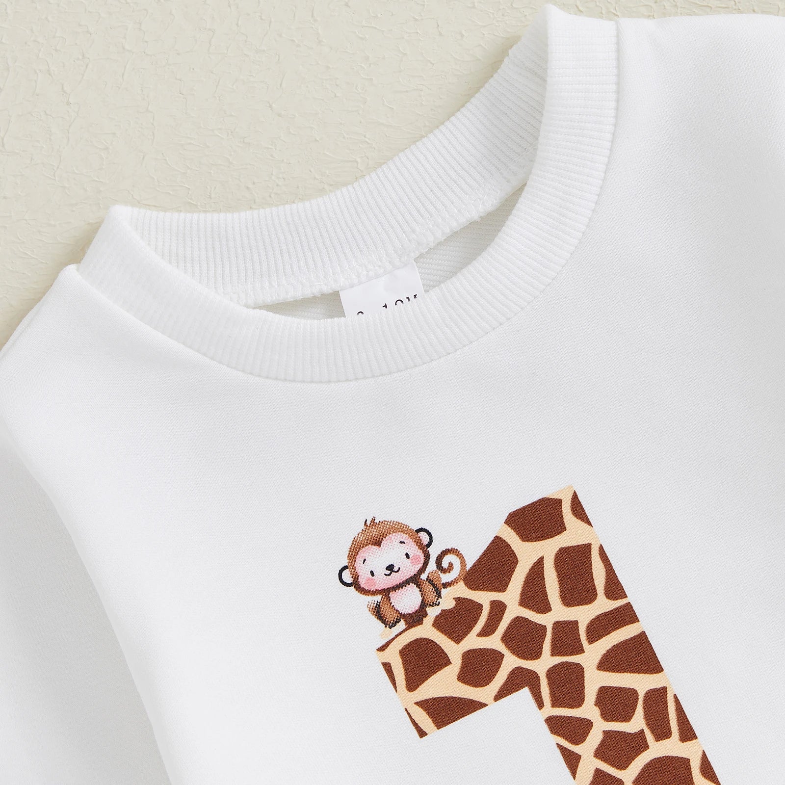 BeQeuewll Toddler Fall Suit Animal Print Sweatshirt and Pants First Birthday Set with giraffe pattern number one and cute monkey on white fabric
