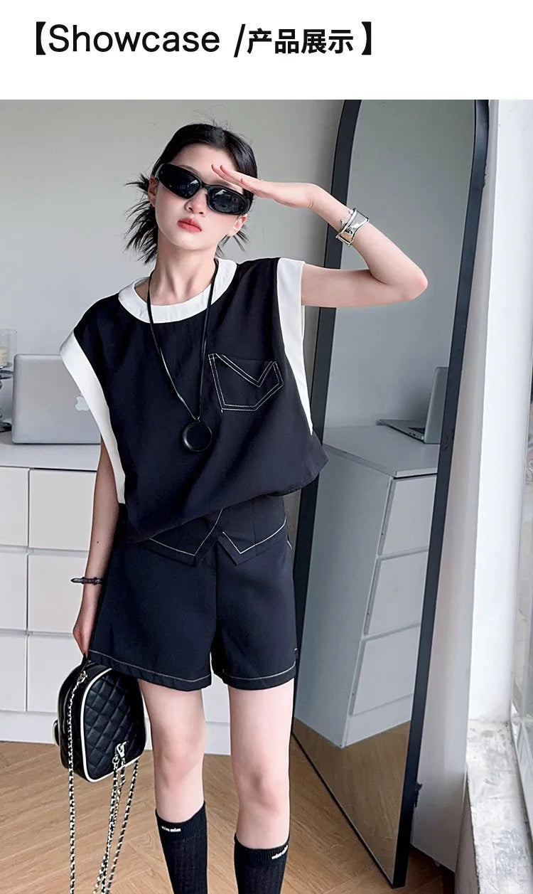 Black and White Spliced Vest and Shorts Two-Piece Casual Sports Outfit Set by Yamza Tots' Closet worn with sunglasses and handbag