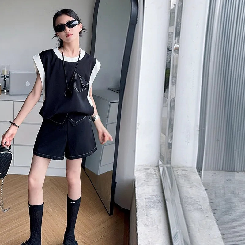 Black and White Spliced Vest and Shorts Two-Piece Casual Sports Outfit Set worn by a woman with sunglasses and black knee-high socks