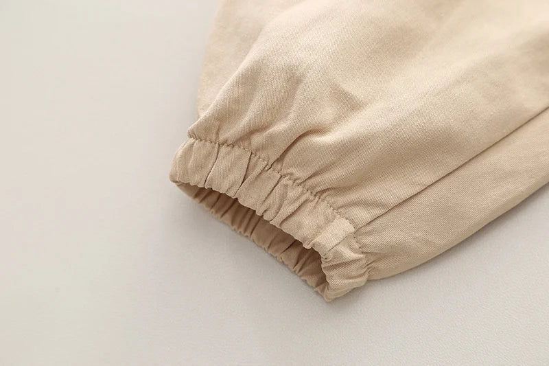 Close-up of beige cargo pants cuff with elastic wrist detail from Boys' Casual Fashion Set Long Sleeve Shirt & Cargo Pants Trendy Daily Wear