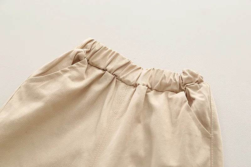 Close-up of beige cargo pants with elastic waistband from Boys' Casual Fashion Set Long Sleeve Shirt & Cargo Pants Trendy Daily Wear