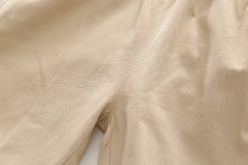 Close-up of beige cargo pants fabric from Boys' Casual Fashion Set Long Sleeve Shirt & Cargo Pants Trendy Daily Wear