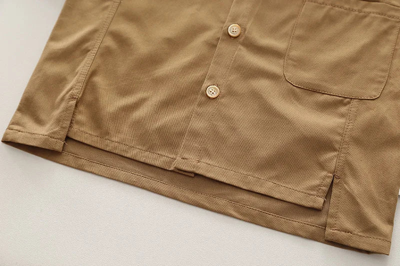 Close-up of brown long sleeve shirt hem with buttons and pocket from Boys' Casual Fashion Set Long Sleeve Shirt & Cargo Pants Trendy Daily Wear